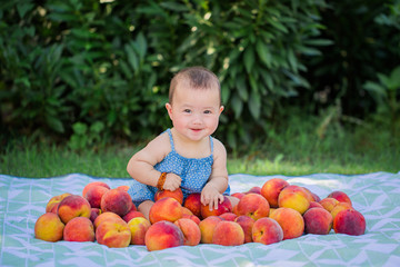 Fototapeta na wymiar Baby Girl Sitting With Fresh Peaches