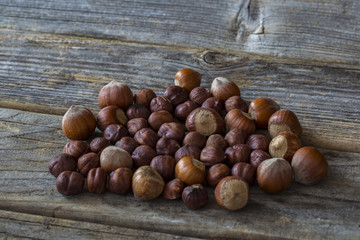 on a wooden table lie the hazelnuts - autumn harvest