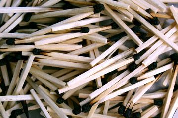 texture of used wooden matches lie in heap