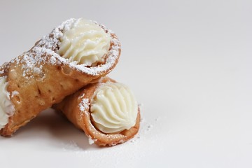 Cannoli isolated on white, selective focus