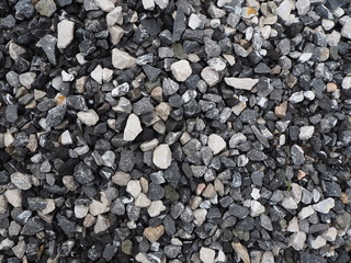 Gravel texture background. Dark grey with white gravel.
