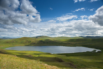 Lake Shunet from height, calm turquoise water in sunny day