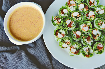 Salad roll with peanut spicy sauce healthy food menu..Mixed Vegetables wrapped with rice noodles and sauce.