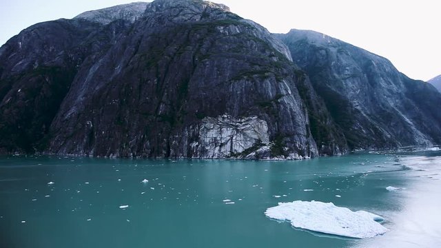The Rock and an iceberg in Tracy Arm Fjord near Juneau, Alaska. Untamed, natural wilderness and wildlife with incredible landscape. Slow motion.