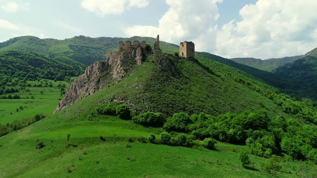 Drone flight at Coltesti Fortress, Transylvania, Romania on a spring sunny day with beautiful clouds