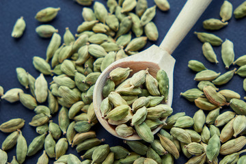 Super food cardamom health food selection in spoon.