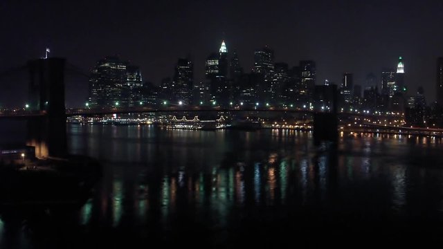 Timelapse of Manhattan Island night skyline from Brooklyn Bridge Manhattan New York