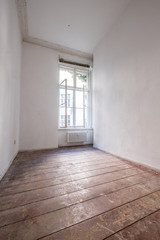 empty room with old wooden floor - apartment renovation concept