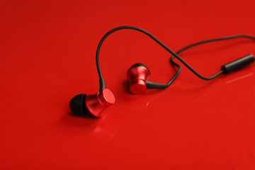 Red Colored Wired EarPhone on Red Background