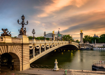 Ponte de alexandre bridge in paris france during sunrise with golden light
