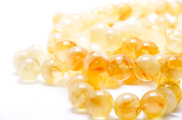 amber beads on a white background