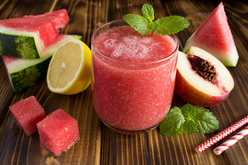 Smoothies from watermelon and nectarine on the brown  wooden background