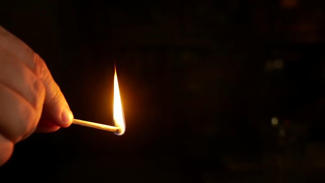 Lighting a wooden match in slow motion.