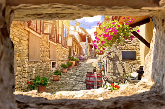 Fototapeta Town of Hum colorful old stone street view through stone window