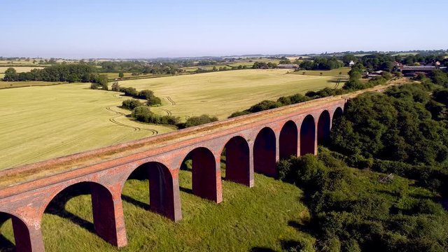 Aerial flyover of a disused railway viaduct in Leicestershire, England.