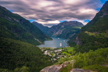 Fototapeta na wymiar Geiranger - July 30, 2018: Panoramic view of the stunning UNESCO Geiranger fjord, Norway