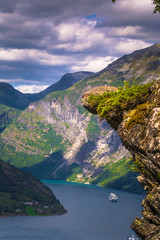 Fototapeta na wymiar Geiranger - July 30, 2018: Panoramic view of the stunning UNESCO Geiranger fjord, Norway