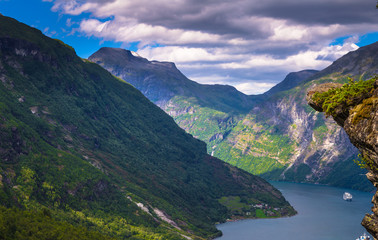 Naklejka na ściany i meble Geiranger - July 30, 2018: Panoramic view of the stunning UNESCO Geiranger fjord, Norway