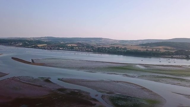 RIGHT to LEFT AERIAL FOOTAGE of the low tide estuary at Lympstone in Devon