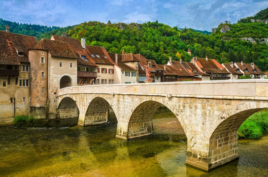 Saint-Ursanne mit steinerner Bogenbrücke, Kanton Jura, Schweiz
