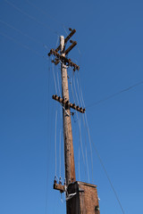 Old vintage electrical pole and lines in the ghost town of Bodie, California
