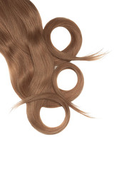 Swirled brown hair on white background