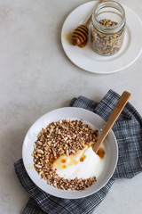 A bowl of homemade granola or muesli and yogurt. Healthy breakfast.