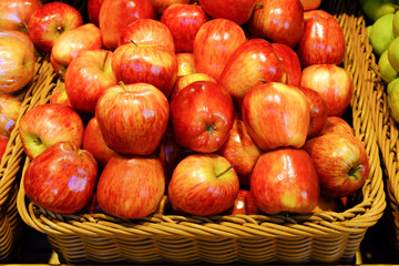 Crop of apples. Many typical ripe apples in a plastic box.
