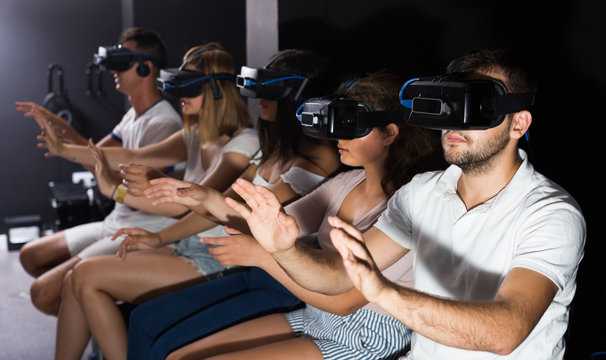 females and males try modern virtual reality glasses