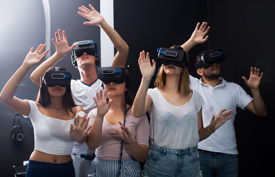 females and males immersed in virtual reality with 3d glasses