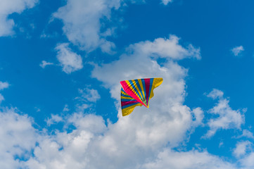 Kite flying in the sky. Couds in the background.