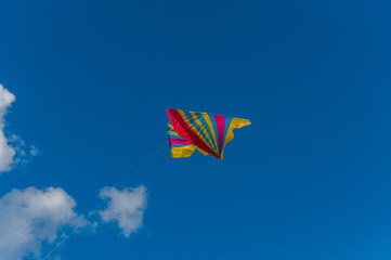 Kite flying in the sky. Couds in the background.
