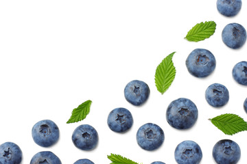 healthy background. blueberries with leaves isolated on white background. top view