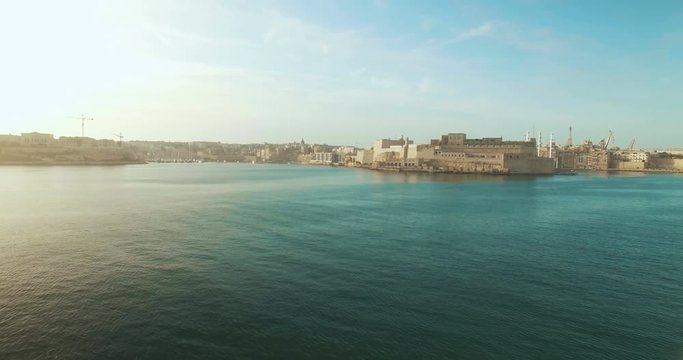 Aerial Shot - Moving over the sea towards the city