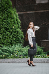 Portrait of a business woman in city streets