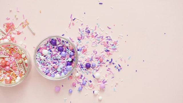 Colorful sprinkle blend on a pink background