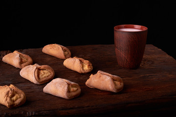 Cottage cheese homemade cookies and cold milk in glass. Close-up. Selective focus.