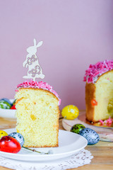 Sweet and appetizing cupcake with pink sprinkling on the table