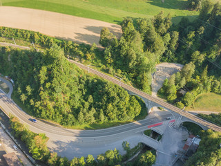 Aerial view of railroad bridge crossing road in Switzerland