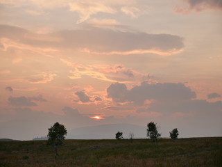 Naklejka na ściany i meble Beautiful summer sunsets in the East Kootenay region