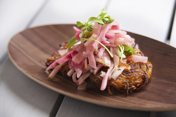 Potato crusted corn patty with pickle onions