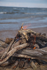 A bonfire burns in a camping i