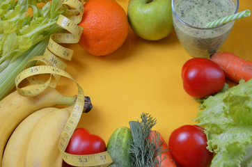 Green healthy juice with fruits and vegetables different colors on yellow background close up, copy space. diet vegitarians healthy low-calorie food