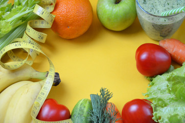Green healthy juice with fruits and vegetables different colors on yellow background close up, copy space. diet vegitarians healthy low-calorie food