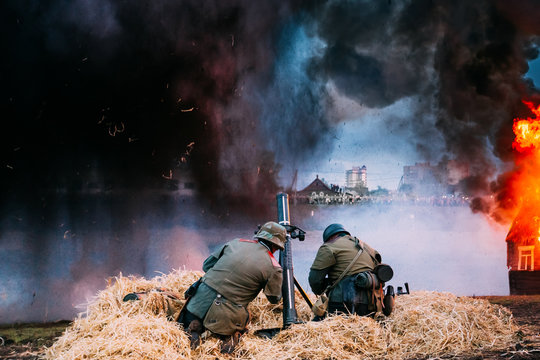Re-enactors Dressed As World War II German Soldiers Fired From A Mortar.