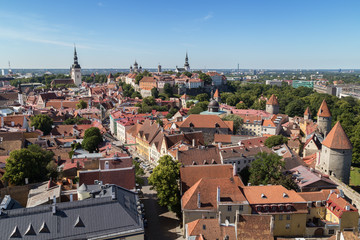 Naklejka na ściany i meble St. Nicholas' Church, St. Alexander Nevsky Cathedral, St. Mary's Cathedral and other old buildings at the Old Town in Tallinn, Estonia, viewed from above on a sunny day in the summer.