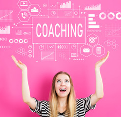 Coaching with young woman reaching and looking upwards