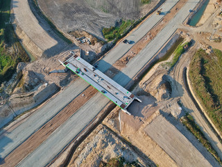 Aerial view on building site of road bridge for city road bypass