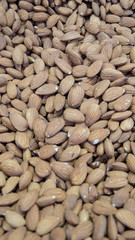 Almond nuts. Almonds background. Organic texture of almonds. Almonds macro. View from above.