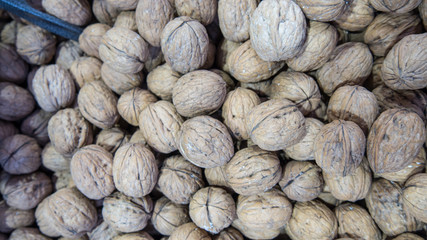 Walnuts background. Walnuts texture. Group walnuts background. Healthy organic food concept. Top view. View above